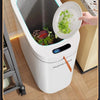 A white Joybos automatic sensor trash can with a large opening is shown, demonstrating its design for easy garbage disposal.