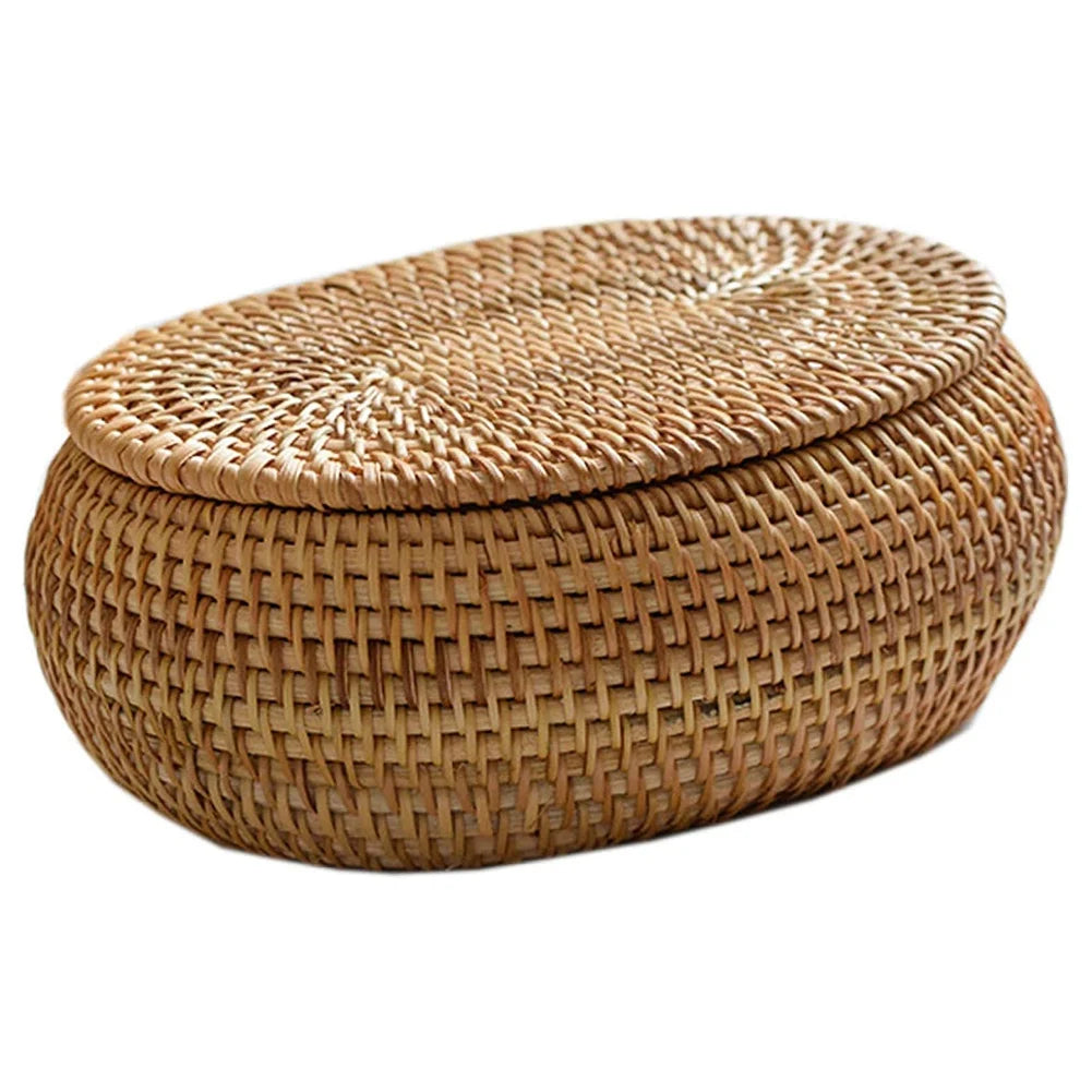 Handwoven rattan storage basket with a lid, made of natural woven material.