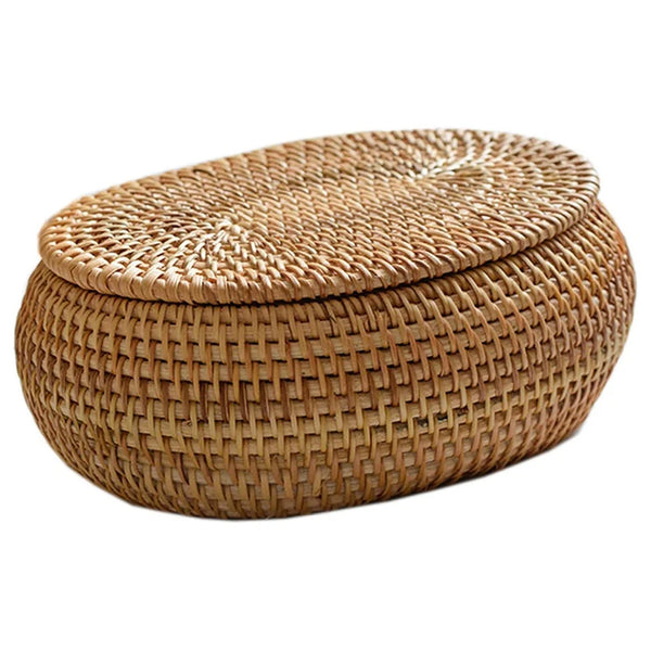 Handwoven rattan storage basket with a lid, made of natural woven material.