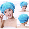 A woman wearing a bright blue microfiber hair drying towel cap, shown in close-up and full view.