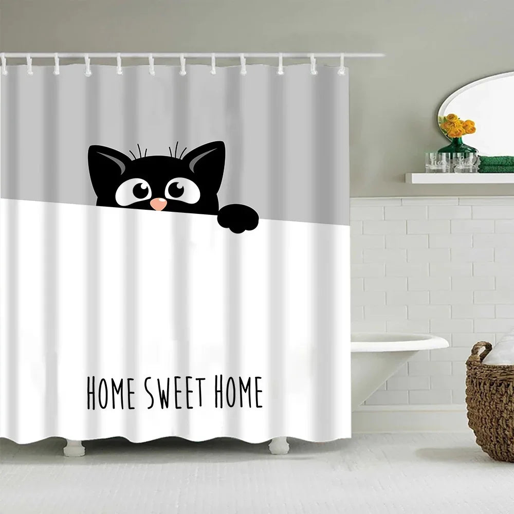 A white shower curtain featuring a black cat cartoon design and the text Home Sweet Home.