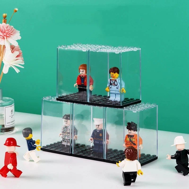 A clear dustproof display case for collectibles featuring various minifigures arranged in tiered sections.