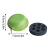 A portable peptide storage case consisting of a green mesh sphere and a black disc with multiple holes.