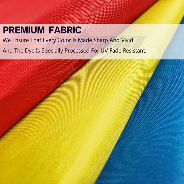 Close-up of a fabric banner displaying vibrant red, yellow, and blue colors.