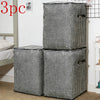 Three black and white checkered foldable clothing storage bags standing vertically.