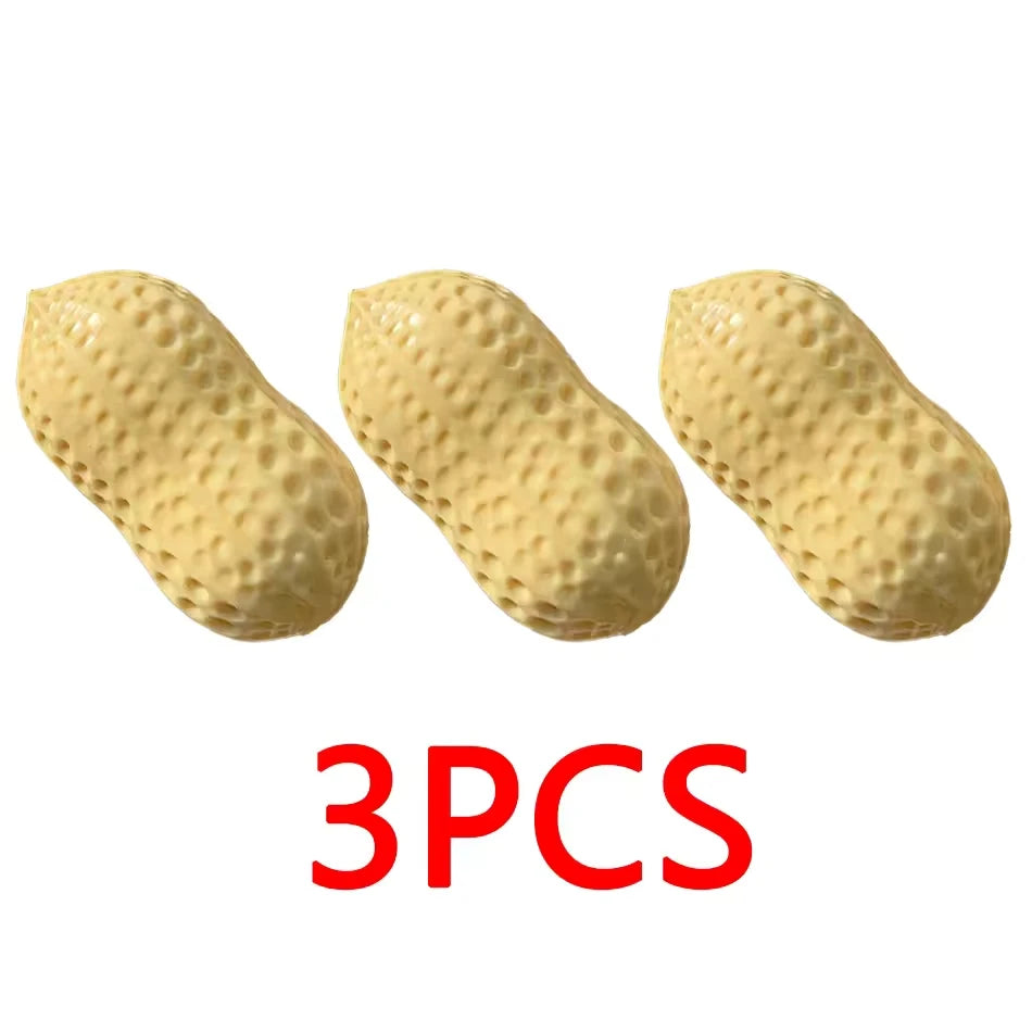Three yellow peanut-shaped squishy stress relief toys