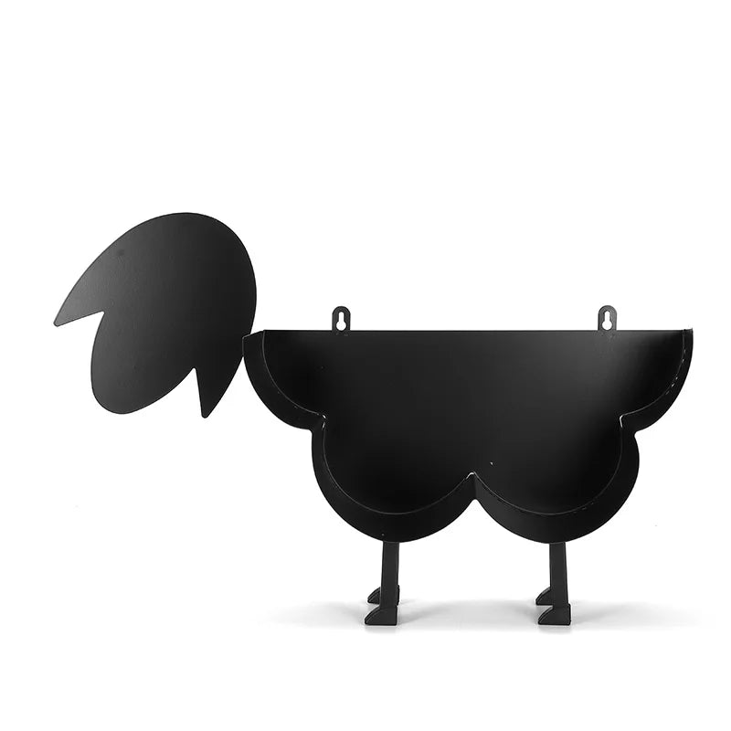 Black novelty animal toilet paper holder and storage rack with a stylized animal shape.