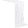 White boho sheer fabric table runner draped in a vertical pleat