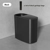 A sleek black odor-sealing trash can with a press lid, shown on a gray surface.