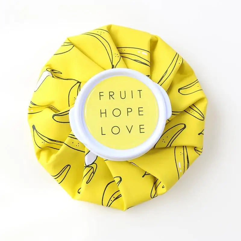 A yellow fabric pack with a citrus print and a white circular label that reads Fruit Hope Love