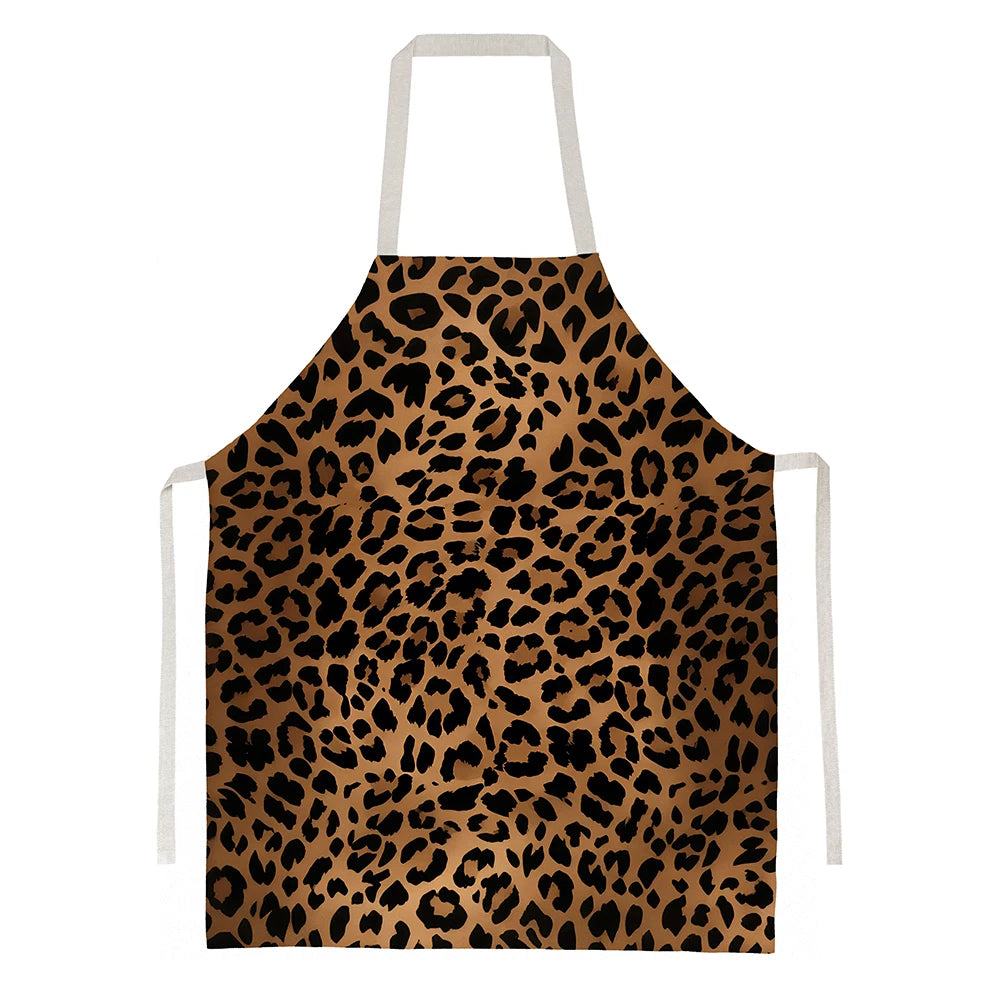A brown leopard print kitchen apron with white ties.