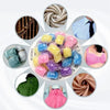 A collection of colorful laundry fragrance beads in various shades and textures.