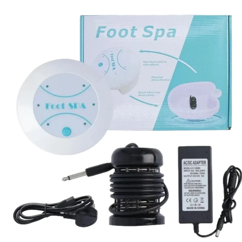 A white ionic foot spa device and an AC/DC adapter are shown next to its packaging.