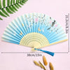 Light blue lace fabric folding hand fan with floral accents shown against a pink background.