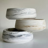 Three stacked ceramic silicone resin molds with white and gray marbled patterns.