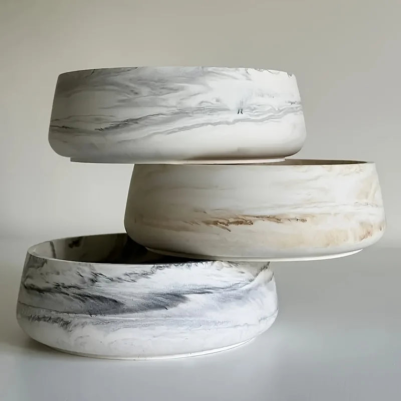 Three stacked ceramic silicone resin molds with white and gray marbled patterns.