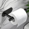A black stainless steel self-adhesive toilet paper holder mounted on a marble wall.