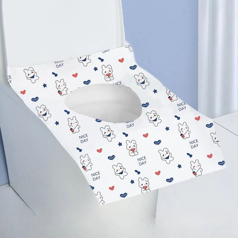A white disposable printing seat cover featuring cute rabbit illustrations and the text Nice Day.