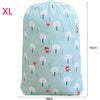 Light blue drawstring storage bag featuring a pattern of white and red trees for laundry or bedding.