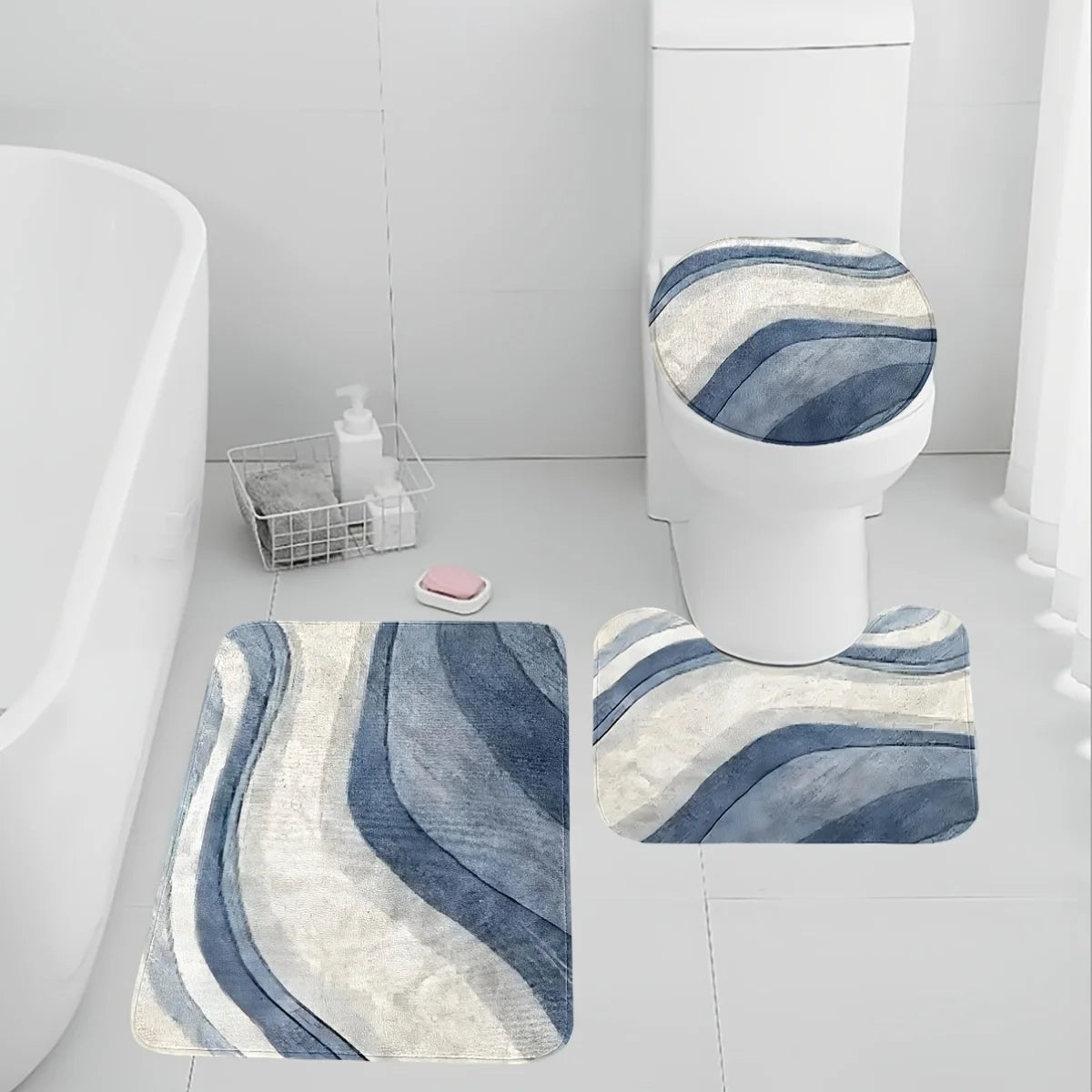 A set of three soft blue and white striped non-slip bathroom rugs, including a toilet mat.