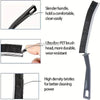 A close-up view of a black crevice cleaning brush showing its slender handle, ultra-fine PET brush head, and high density bri