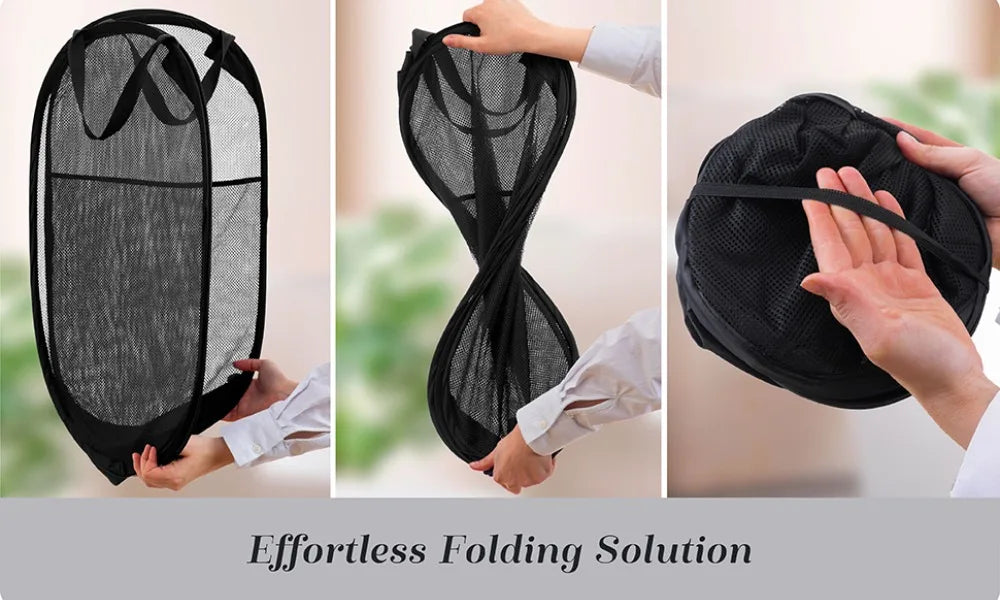 A black collapsible mesh laundry basket organizer being folded or handled by a person.
