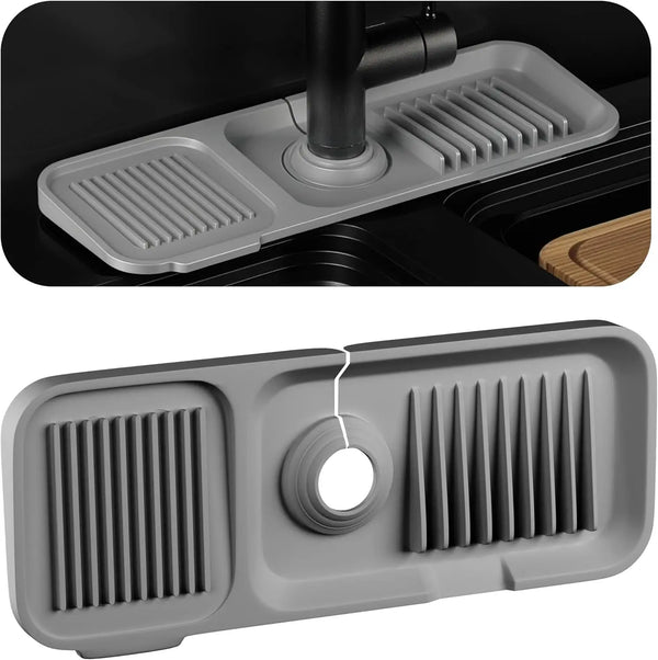 A gray silicone sink splash guard and drip catcher tray with slotted drainage areas.
