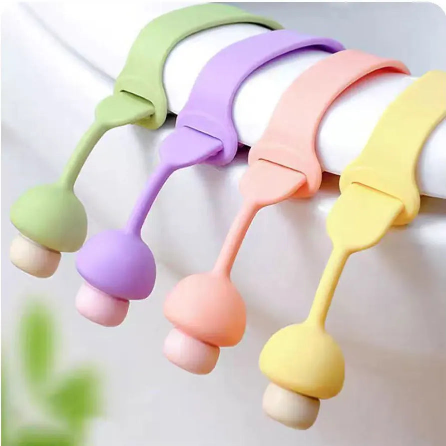 A pack of four silicone toilet lid lifters in pastel colors, including green, purple, pink, and yellow.