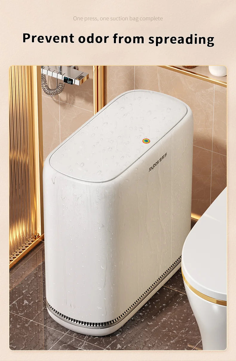 A white slim hands-free trash can with a one-press lid is shown on a bathroom counter.