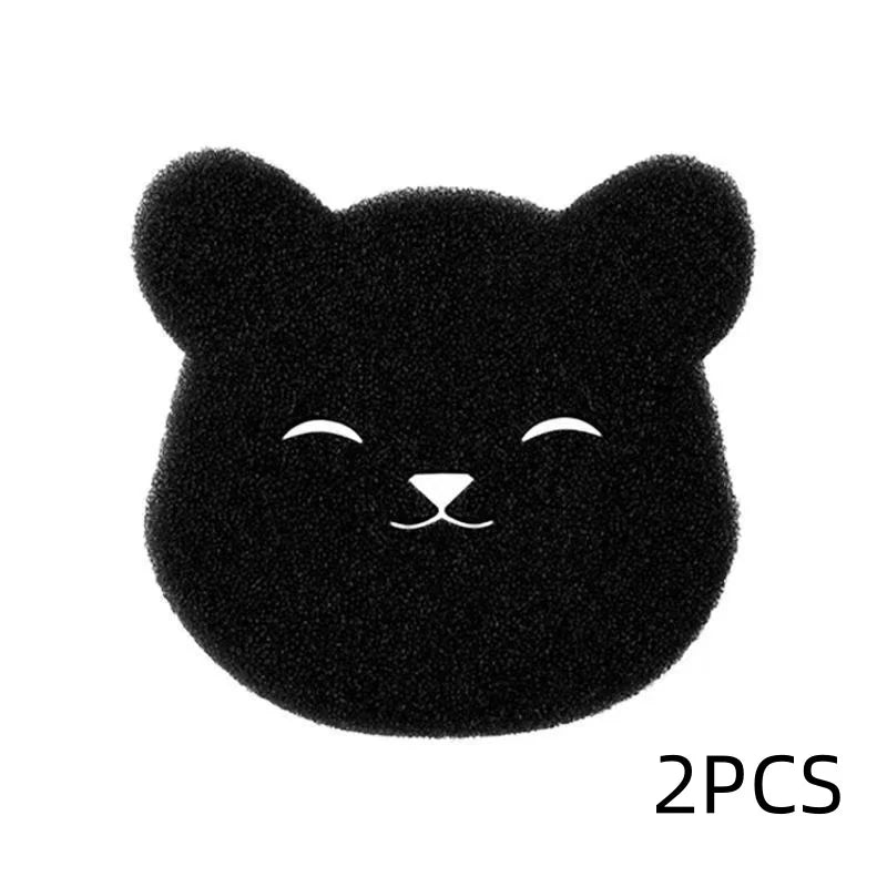 A pair of black, fuzzy cat-shaped pet hair remover sponges.