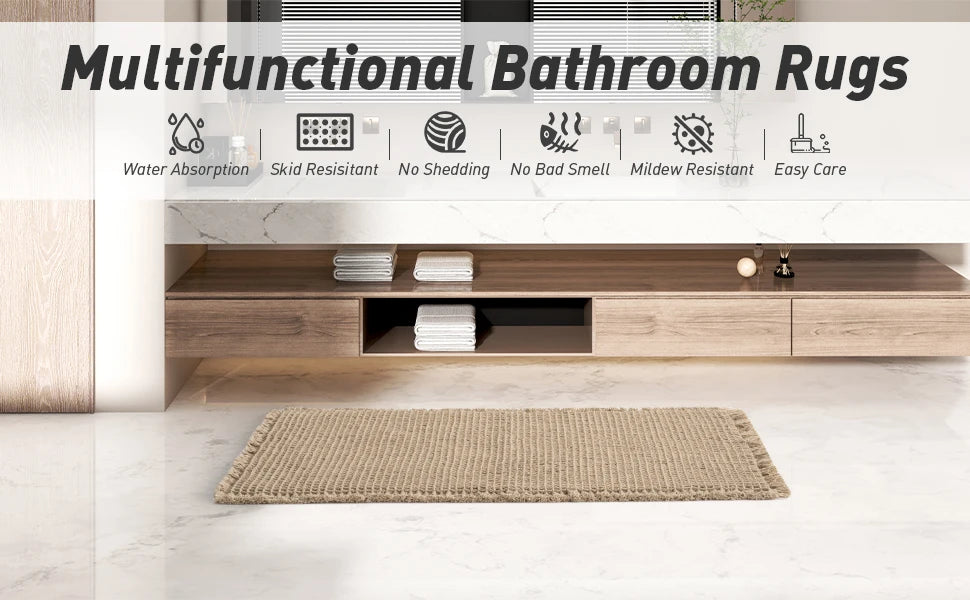 A beige waffle weave bathroom rug is displayed on a light marble floor in a modern bathroom setting.