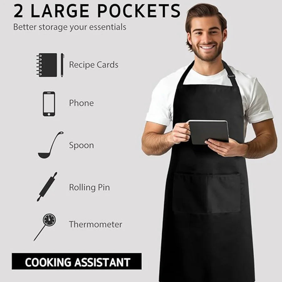 A man wearing a black cooking assistant apron demonstrates the two large pockets for storing essentials like recipe cards, ph