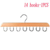 A wooden belt and accessory organizer hanger with 14 hooks.