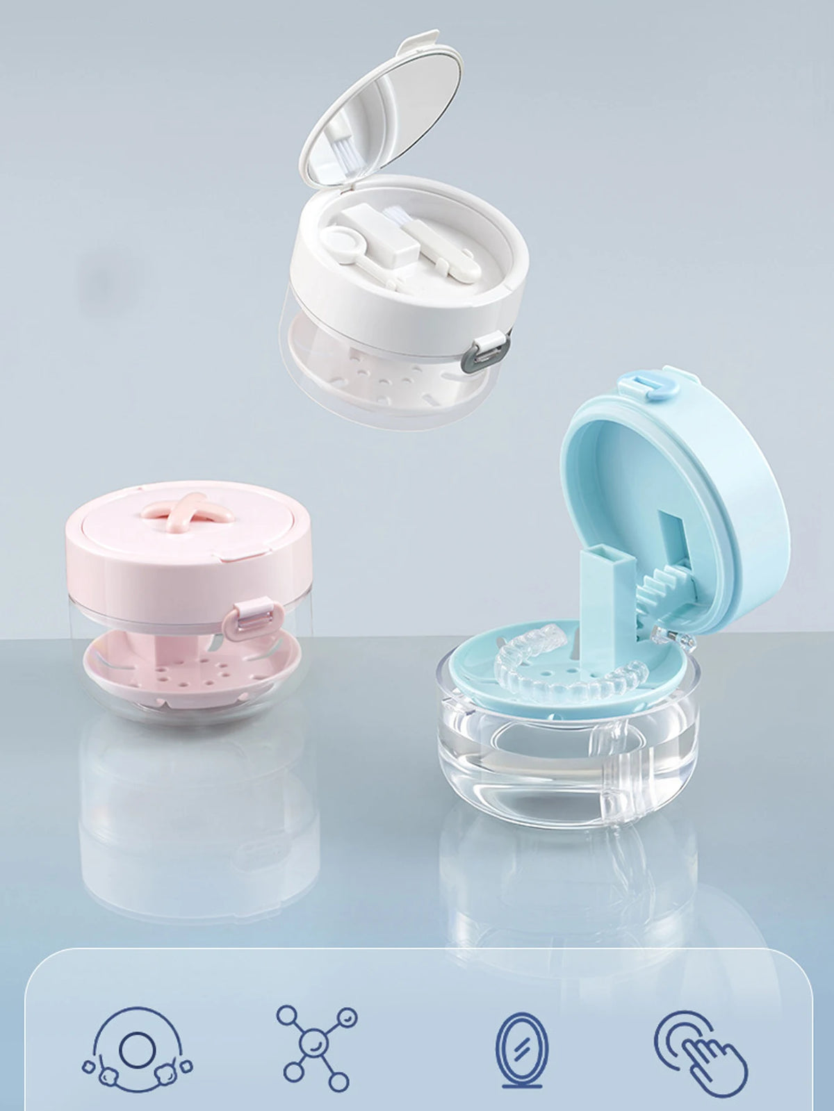 A portable multi-tool organizer for dental appliances shown in pink and light blue plastic containers.