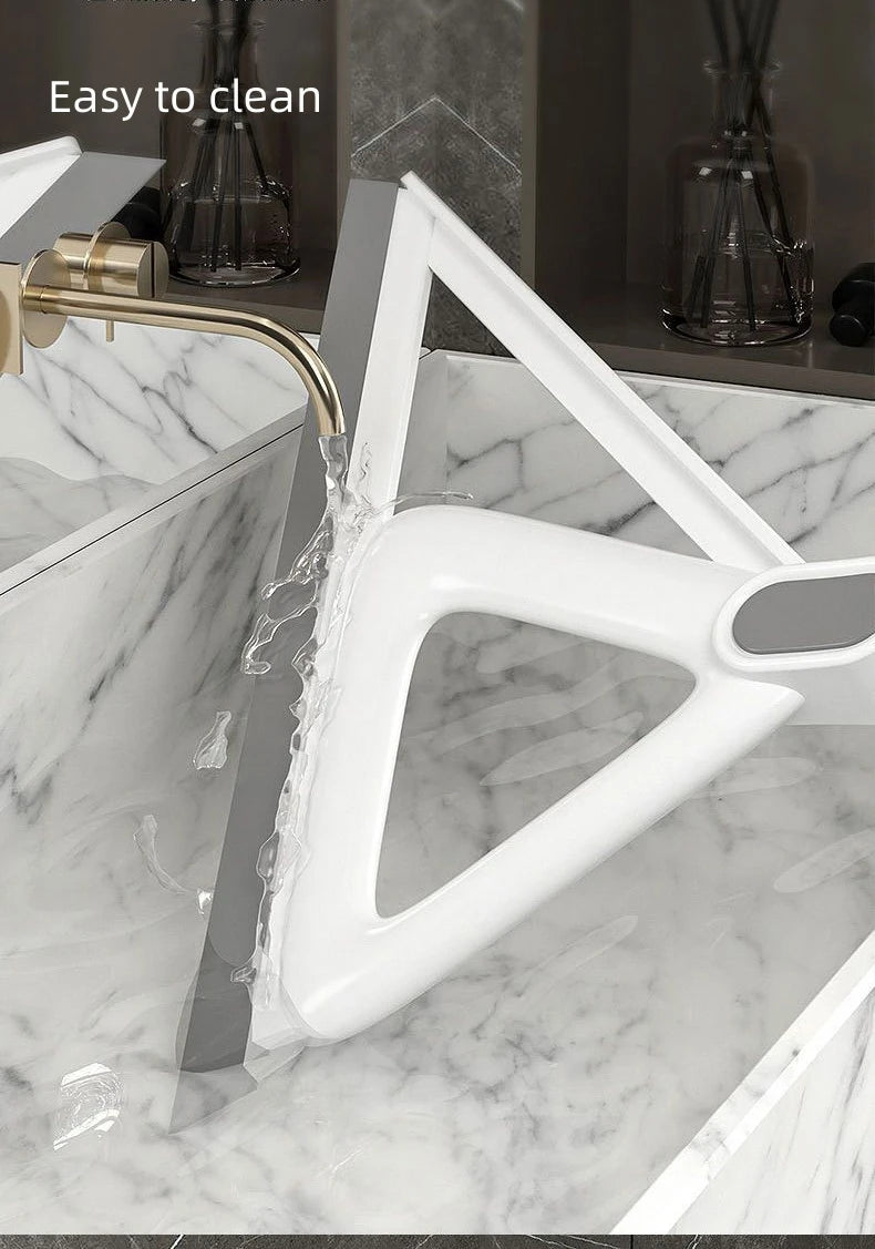A white silicone window and surface cleaner is shown being used to clean a marble countertop.