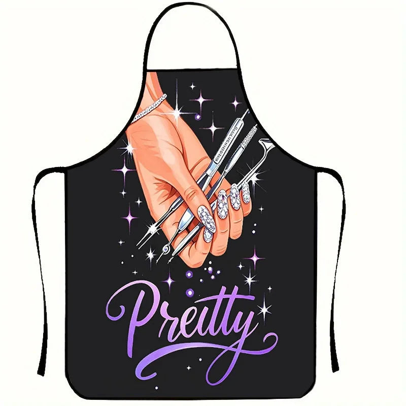 A black apron with a hand painting nails, featuring the word Pretty in purple script.