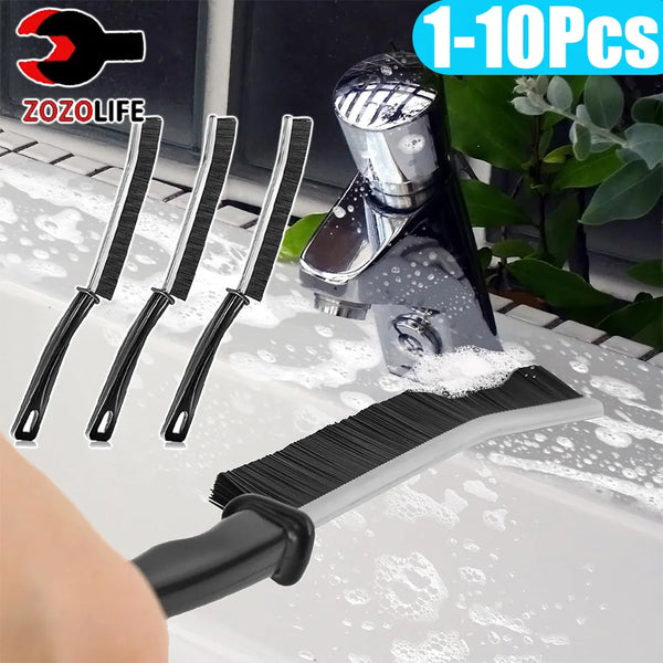 A set of 1 to 10 stiff bristled crevice cleaning brushes and a handheld brush are shown cleaning a sink.