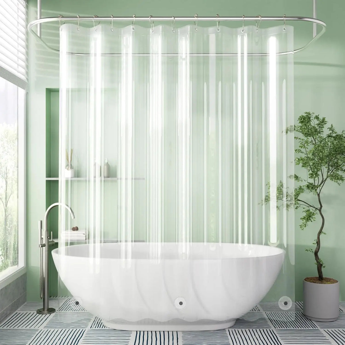 A modern bathroom featuring a white freestanding bathtub under a clear shower curtain with vertical magnetic rods.