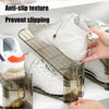 A clear plastic shoe organizer rack holding white sneakers and other shoes.