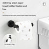 A black towel holder with a drop-proof rod design is mounted on a white surface, next to a white dispenser.