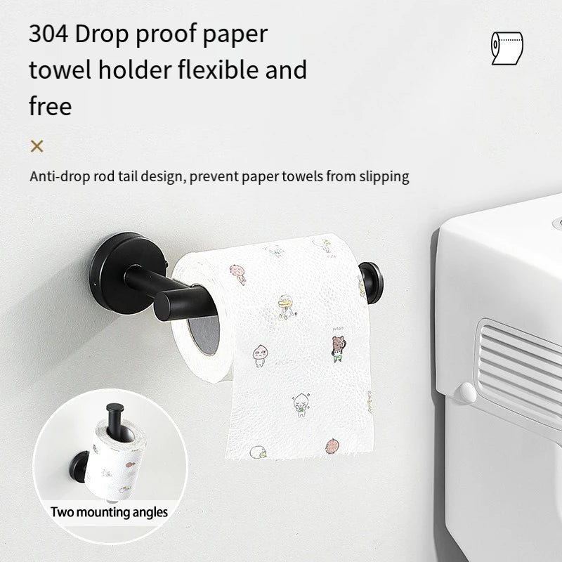 A black towel holder with a drop-proof rod design is mounted on a white surface, next to a white dispenser.