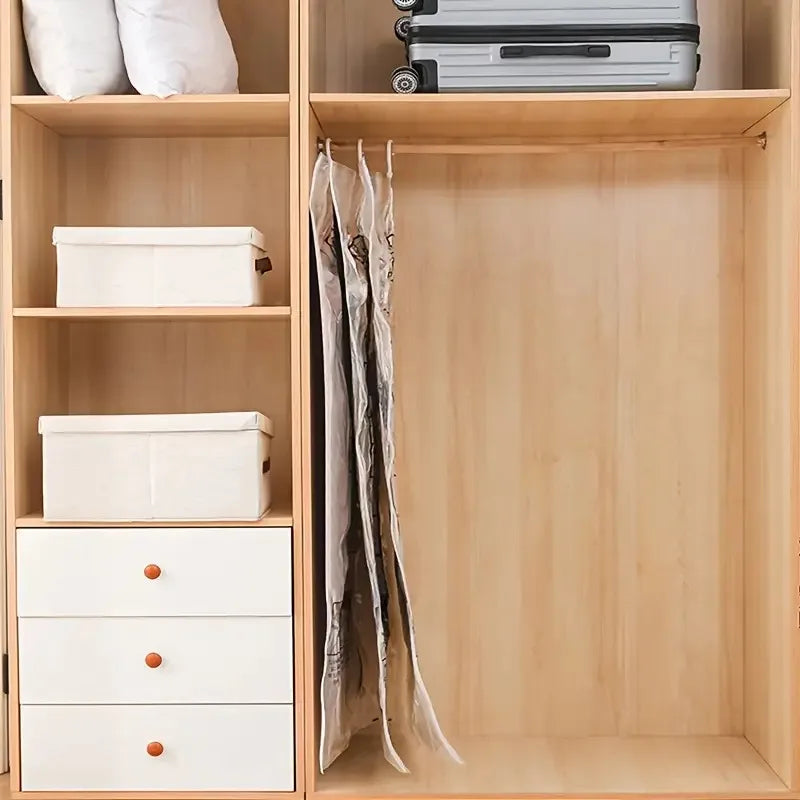 A wooden cabinet with shelves storing white storage boxes and hanging vacuum storage bags.