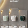 Wall-mounted soap dish with lid and drainage in white, light green, and dark green colors.