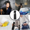 A black multi-functional handheld spray bottle being used to mist a surface.