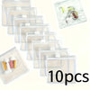 A set of ten clear plastic organizer bags for travel medicine with separate compartments