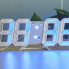 A white 7-segment digital alarm clock displaying the time 08:08, illuminated with blue light.