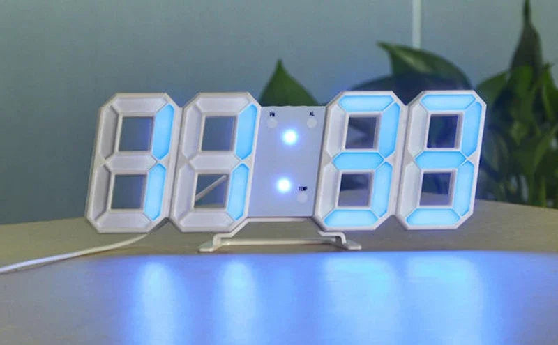 A white 7-segment digital alarm clock displaying the time 08:08, illuminated with blue light.