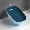 A blue suction cup soap dish with built-in drainage features and dimensions marked.