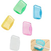 A collection of ten clear and colored silicone protective caps for a toothbrush head, including green, blue, yellow, and pink