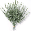 A bunch of artificial baby's breath flowers in a muted green color.